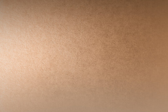 Bright natural soft light brown tone color gradation paint on recycled cardboard box blank environmental friendly paper texture background minimal style with space