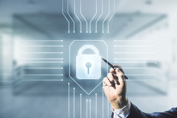 Double exposure of male hand with pen working with virtual creative lock hologram with chip on blurred office background. Information security concept