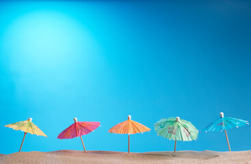 Fototapeta na wymiar Cocktail umbrellas on the beach