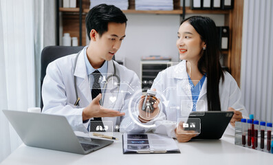 Medical technology network team meeting concept. Doctor hand working with smart phone modern digital tablet and laptop computer with graphics chart interface, with virtual icon diagram.