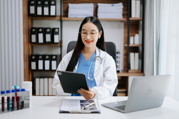 Medicine Asian doctor working with modern digital tablet computer interface as medical network concept