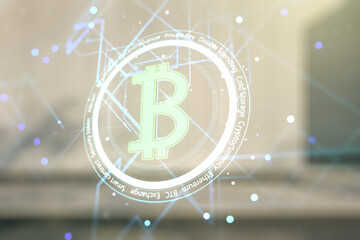 Double exposure of creative Bitcoin symbol hologram on modern business center exterior background. Cryptocurrency concept