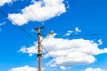 Power electric pole with line wire on colored background close up