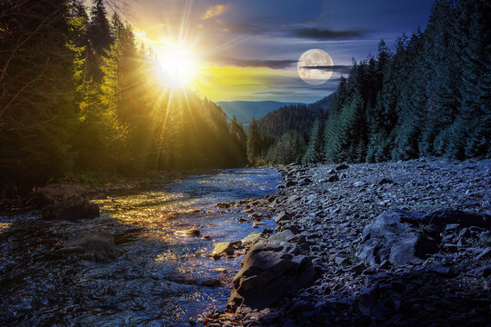 day and night time change concept. autumn landscape with sun and moon at twilight. rocky shore of the river that flows near the pine forest at the foot of the mountain in morning light