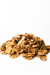Muesli from various cereals with raspberries, raisins, coconut on a white background
