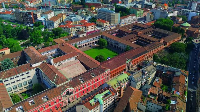 Aerial view of the Universit&agrave; degli Studi di Milano. Beautiful old architecture of buildings with courtyards. Roofs. Flight over buildings. Italy, Milan, 07.2023