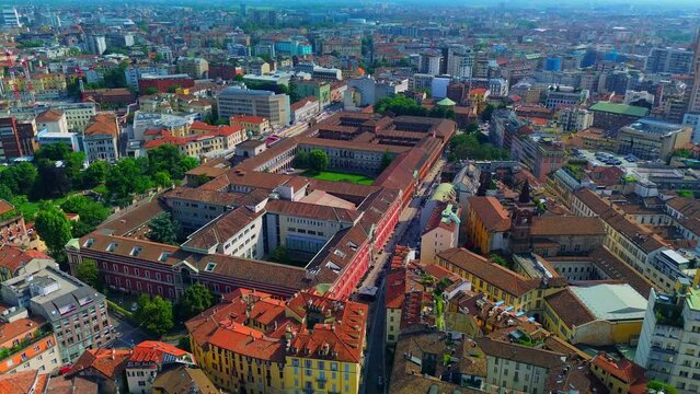 Aerial view of the Universit&agrave; degli Studi di Milano. Beautiful old architecture of buildings with courtyards. Roofs. Flight over buildings. Italy, Milan, 07.2023