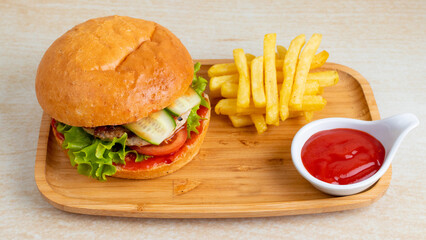 Chicken burger and fries on tray