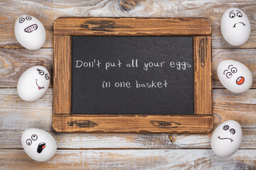 Don't put all of your eggs in one basket background. Funny eggs with different mood faces. July 9 -...
