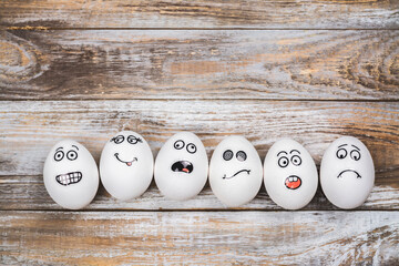 Don't put all of your eggs in one basket background. Funny eggs with different mood faces. July 9 - National Dont Put All Your Eggs in One Omelet Day