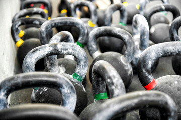 Pile of kettlebells in gym
