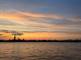 Fototapeta na wymiar fantastic sunset colors at the city river, tender heaven, riverside