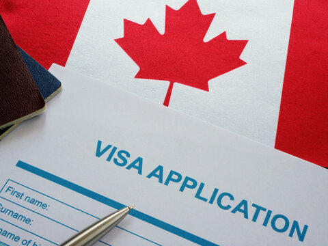 Empty Visa Application Form And Canada Flag.