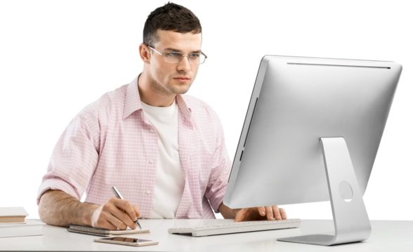 Smiling business man working on laptop at the home office.
