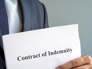 A man holds Contract of indemnity papers.
