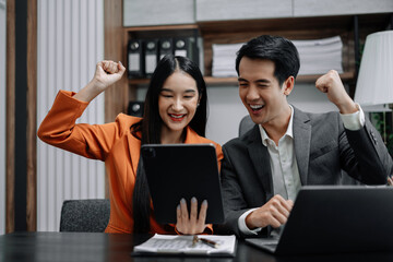 Happy smiling businessman feel happy work complete Teamwork success, success at work in the office concept.