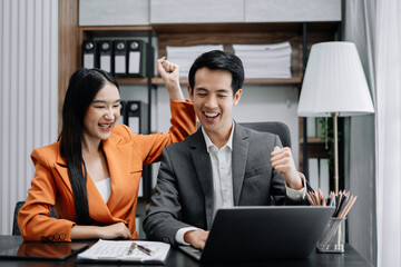 Happy smiling businessman feel happy work complete Teamwork success, success at work in the office concept.