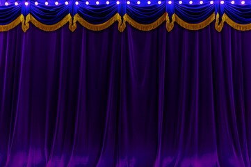 Theater dark pupper and blue curtain and neon lamp around border. - 619431582
