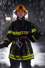 A determined female firefighter in a professional uniform striding through the dangerous, rainy night on a daring rescue mission, showcasing her unwavering bravery and commitment to saving lives.