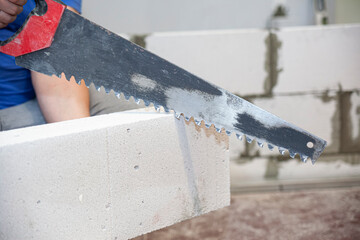 Hacksaw for aerated concrete. The cutout of the doorway in the wall from the gas block is handmade.