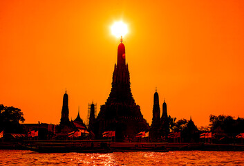 The silhouette of a Buddhist temple in Bangkok: An enchanting outline of a serene Buddhist temple against the Bangkok skyline, exuding tranquility and spirituality