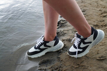 running shoes on the beach
