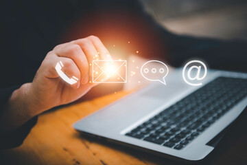 Businessman using Smart Phone with the email, call phone, address, Chat message icons.Customer support hotline Contact us people connection.