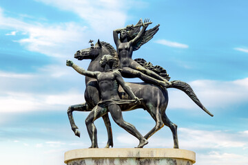 Victory bridge bronze statue on river Adige. statue of a man, a woman and a horse. Equestrian...