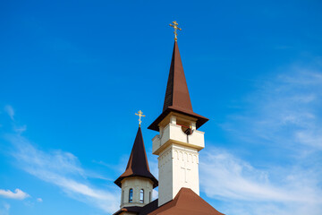 Obraz premium Tower of the church against the blue sky . Orthodox belfry architecture