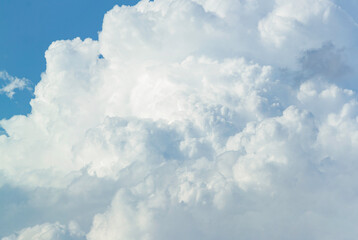 White puffy fluffy cloudscape with clear blue sky. Beautiful cumulus cloudscape textures.High...
