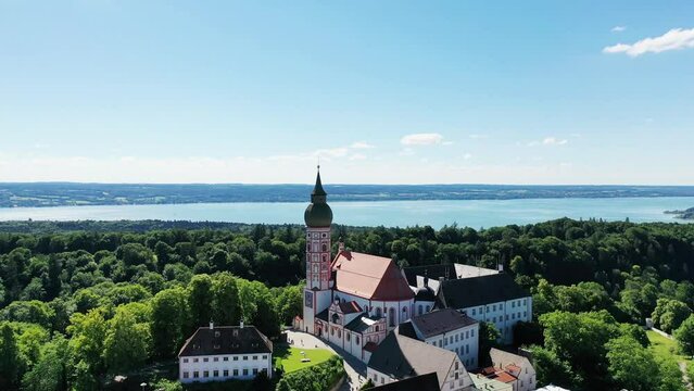 Drone video of Andechs Monastery with a view of Lake Lake Ammer in the background. Andechs, Starnberg, Upper Bavaria, Bavaria, Germany, Europe