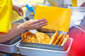 pack a delicious hot cheburek in edible yellow paper. Street food, food to go