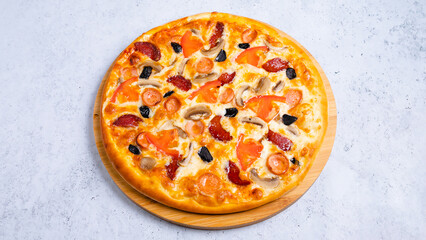 Pizza with vegetables and sausages