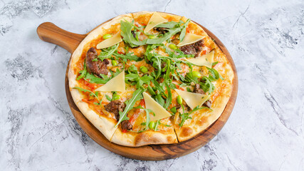 Beef pizza with greens