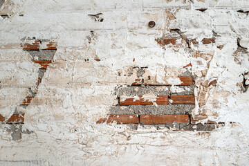 Surface of grunge white cement wall with brick structure. Background space and textured photo.