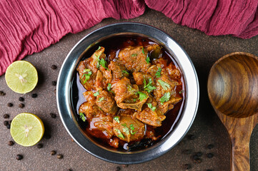 Mutton curry served in a bowl.