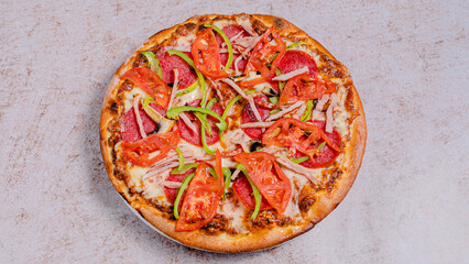 Pizza with vegetables and sausages