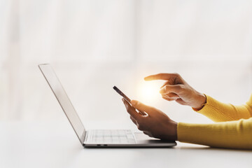 Type search information from the Internet network. Businessman working with smartphone, tablet and laptop computer on table in office. network concept