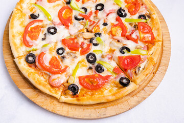 Vegetables and sausage pizza close up