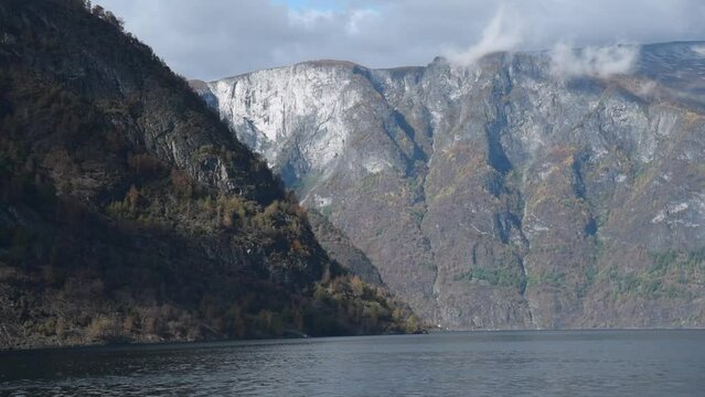 View from an electrical cruise ship on Sognefjord,  Aurlandsfjord Flam, Norway. Impressive autumn mountain landscape of fjords and blue water