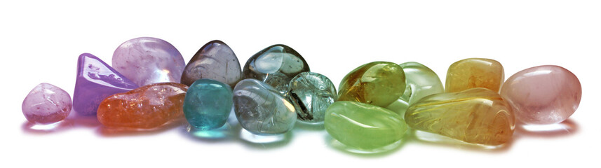 A selection of  chakra multi colored tumbled healing crystal semi precious gem stones isolated transparent png file - 619457144