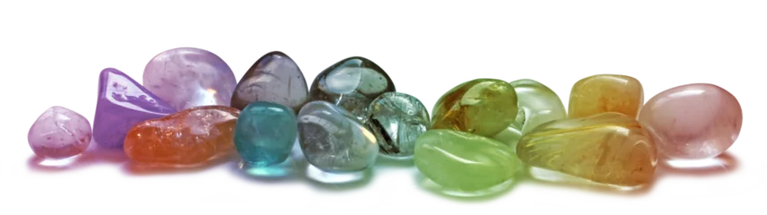 Keuken spatwand met foto A selection of  chakra multi colored tumbled healing crystal semi precious gem stones isolated transparent png file © Nikki Zalewski