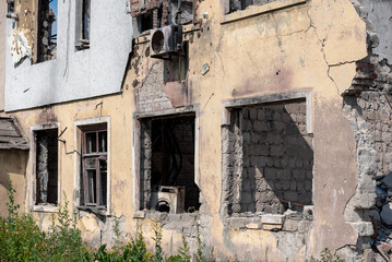destroyed houses in an abandoned city without people in Ukraine