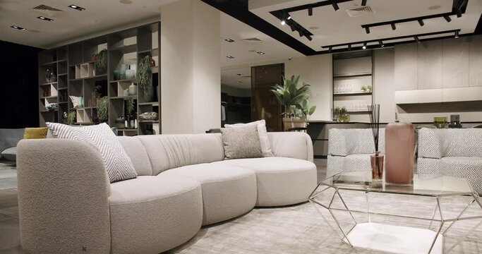 Modern contemporary Minimalist living room with white and beige furniture and white kitchen room. Fashionable furniture. Cozy Modern Furniture Design. Luxury Elegant Room. Real Estate private home.