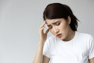 Stressed Asian Woman with Headache, Managing Stress and Finding Relief for Headache Pain