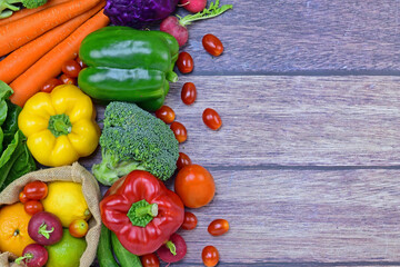 Top view of vegetables on wood background with copy space for text.