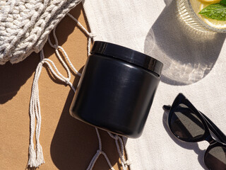 Black plastic jar mockup. Packaging with long shadow. Summer flatlay