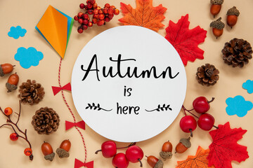Fototapeta na wymiar Fall Decoration, Autumn Leaves and Kite, With Text Autumn Is Here
