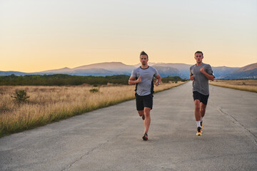 Group of handsome men running together in the early morning glow of the sunrise, embodying the essence of fitness, vitality, and the invigorating joy of embracing nature's tranquility during their