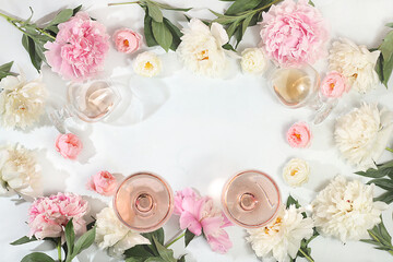 Still life with different types of rose wine, summer alcoholic cocktail for a party and peony...